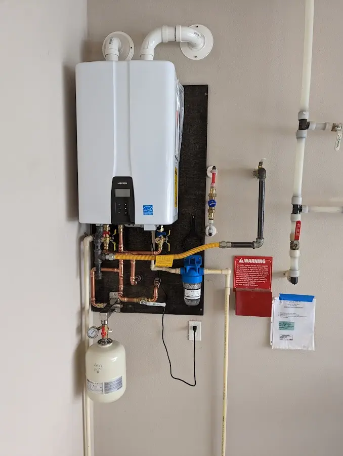 Professional plumber installing copper piping in a Hobart home